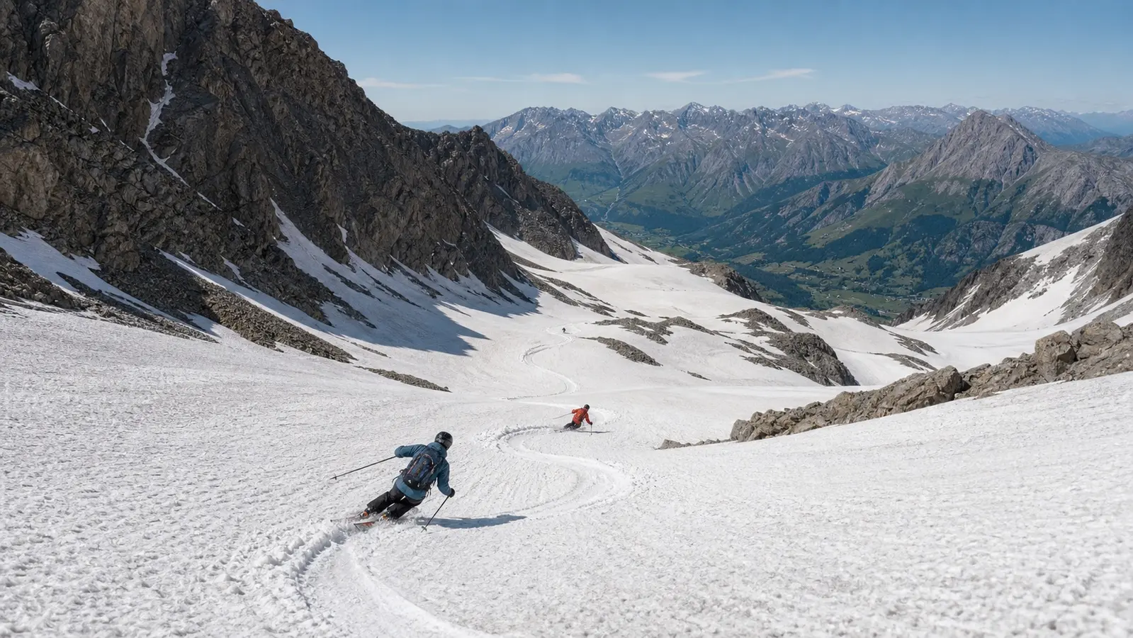 Two skiers crossing bright summer snow high in the European Alps